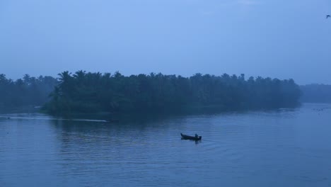 sunrise in backwaters,fishermen arriving shore