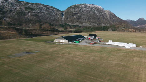 Dairy-Farming---Milk-Farm-With-Stack-Of-Wrapped-Bales-In-Norway