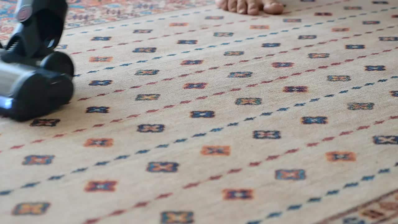 Vacuuming a carpet