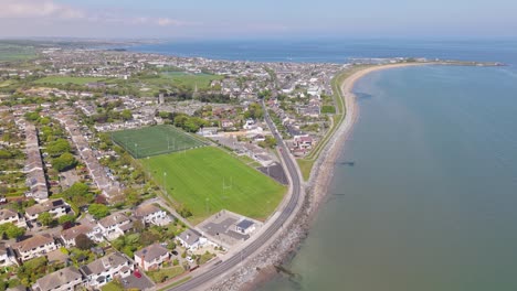 the sweeping coastline of a charming irish seaside town in skerries, ireland