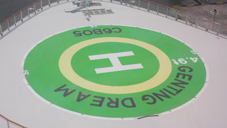 helipad on ship green sign to hand on the nose of cruise