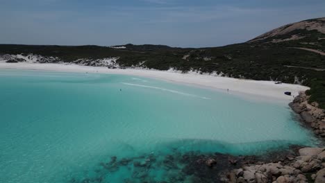 Tourist-at-Wharton-Beach-and-Clear-Turquoise-Ocean-Water-in-summer-season