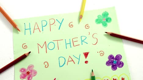 color pencil arranged around mothers day greetings card