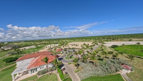 aerial fpv flight over golf course at corales golf club in punta cana during sunny day