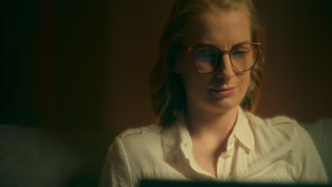 woman working on laptop at night