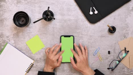 smartphone with chroma key on table. woman working on smartphone at home office. businesswoman writing business letter at work on mobile phone. modern work desk