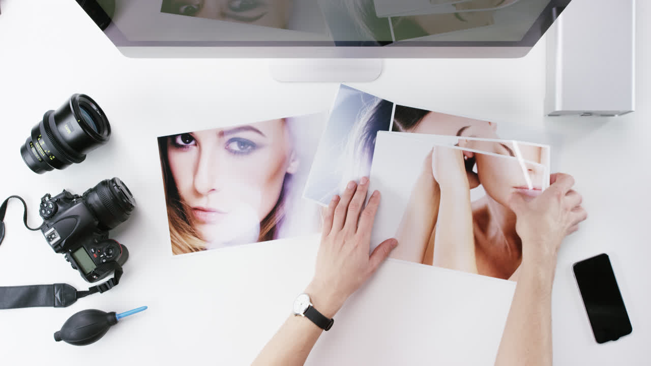 Top view photographer graphic designer chosing beauty images working at desk from above - Red Epic Dragon