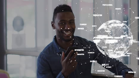 Animation of interface showing globe and data with smiling businessman using smartphone