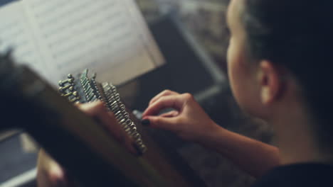 female kobza player. woman playing bandura music. pandora musical instrument