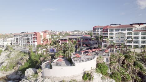 drone-flying-by-hotel-on-cliff-in-Cabo-San-Lucas-Mexico