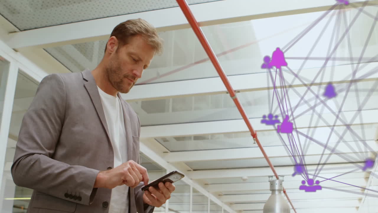 Using smartphone, businessman interacting with digital network animation overlay