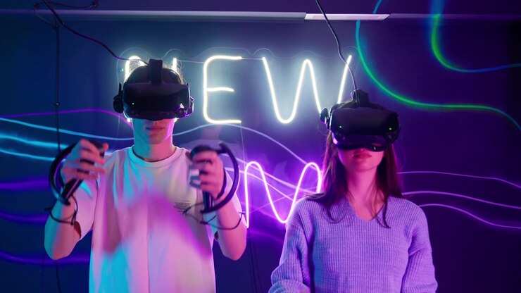 Young Couple Puts on VR Headsets and Starts Playing Virtual Reality Game