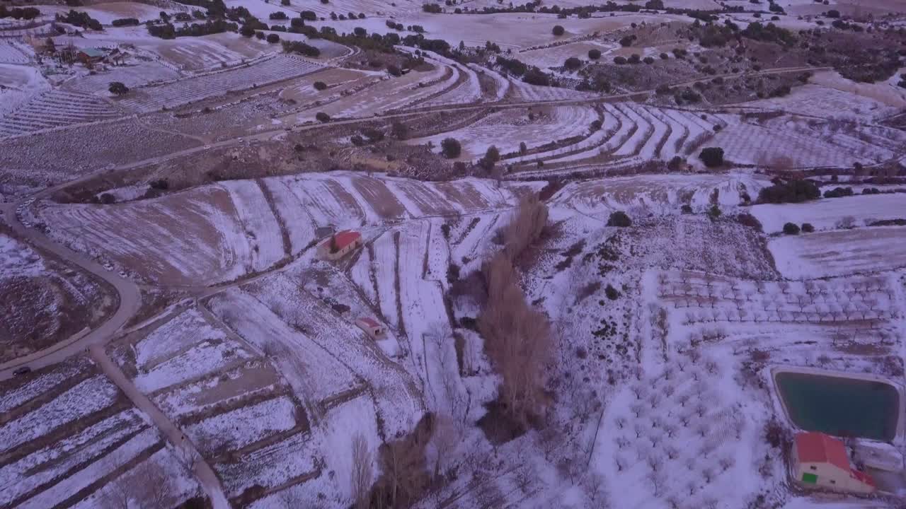drone panning up from snowy mountains in spain with snow