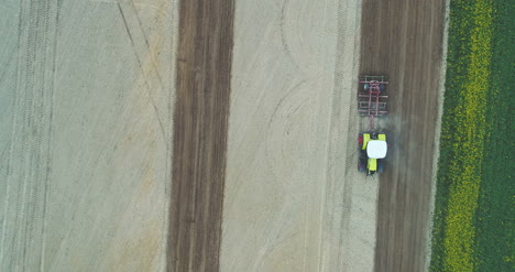 Agricultural-Tractor-Cultivating-Field-