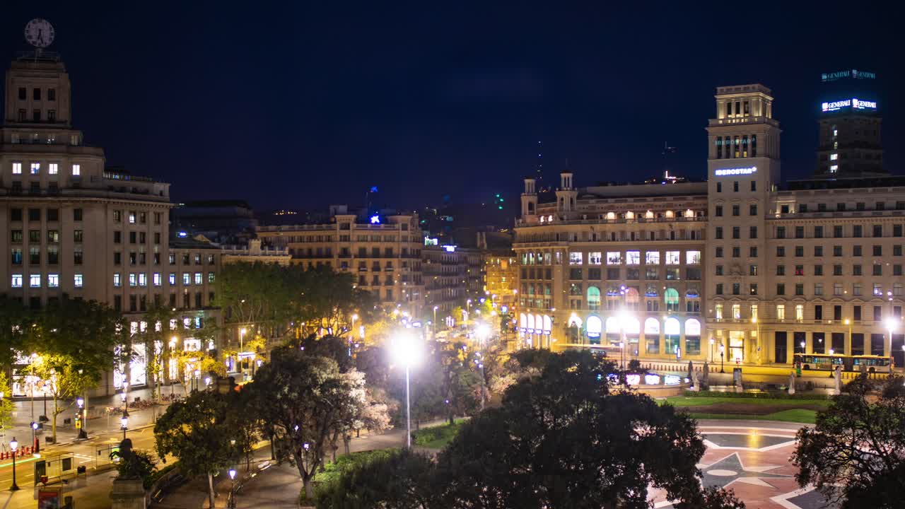 Time lapse video taken from a height - of Placa Catalunya, the central square in the city of Barcelona, Spain - showing transition from night to day.