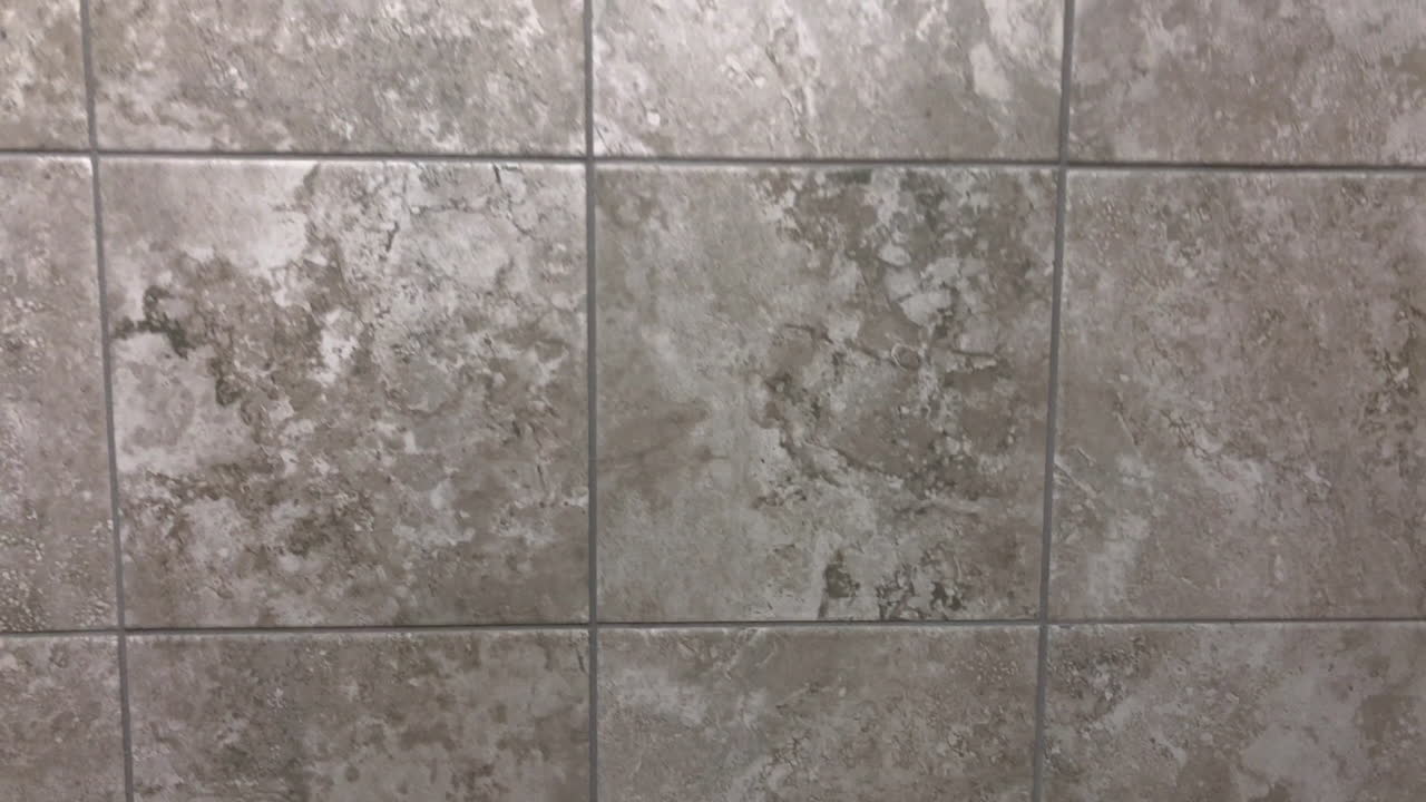 Dark gray wall tiles or floor tiles in slow motion