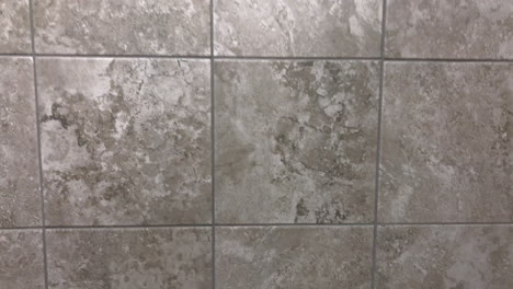 dark gray wall tiles or floor tiles in slow motion