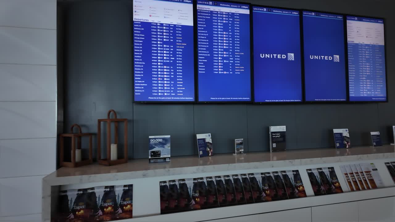 Modern Airport Lounge with United Airlines Flight Information Displays