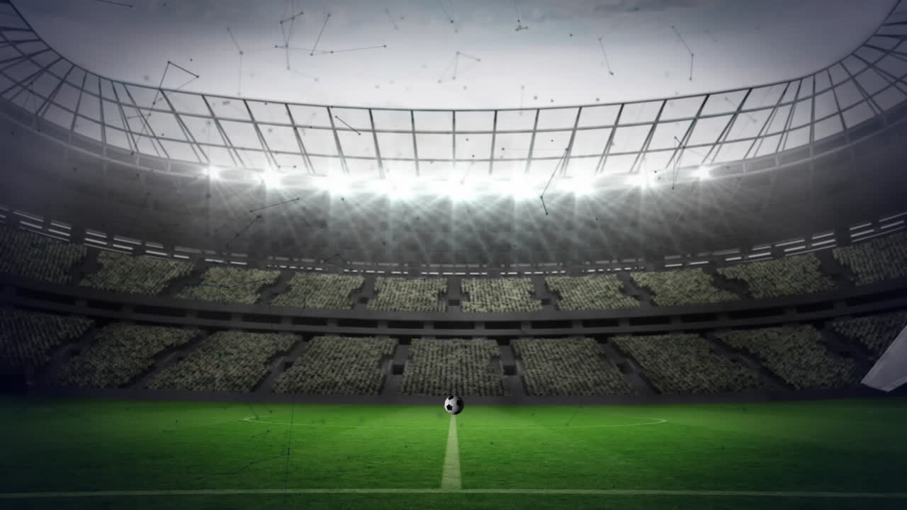 fútbol rompiendo vidrio sobre la red de conexiones contra el estadio deportivo en el fondo