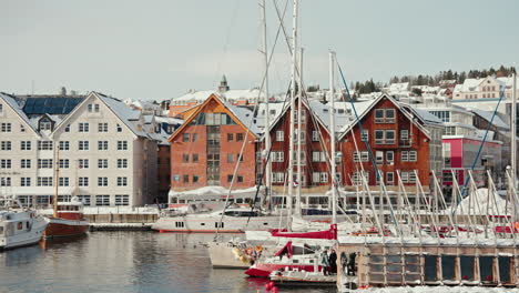 slow motion of tromso harbor covered in snow