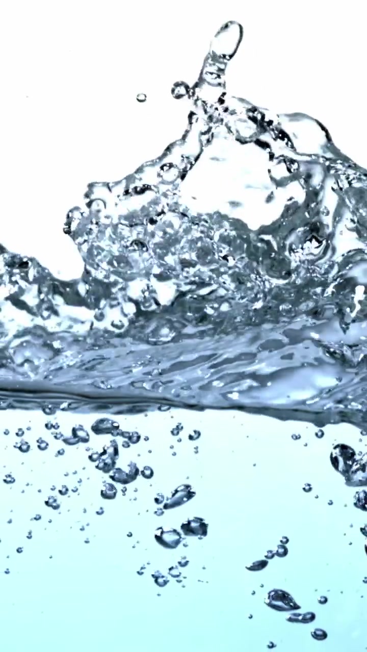 Clear Water Pouring and Splashing with Bubbles on White Background