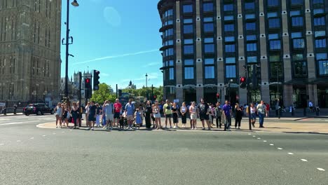 pedestrians crossing at a busy london intersection