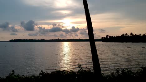 silhouette sunset in vembanad lake,sunset over vembanad lake,backwaters sunset