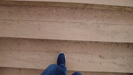 walking up wooden stairs