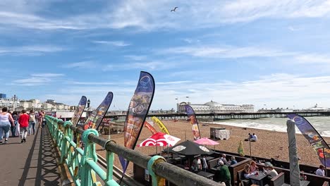 people walking on brighton beach promenade