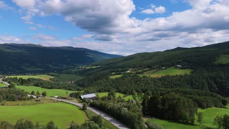 Aerial-view-of-rolling-forested-hillside-and-countryside-in-Besseggen,-Innlandet,-Norway