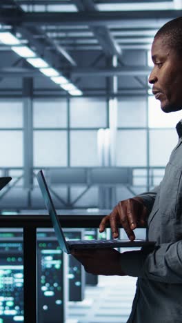 vertical video data scientists performing equipment vulnerability scans in server farm