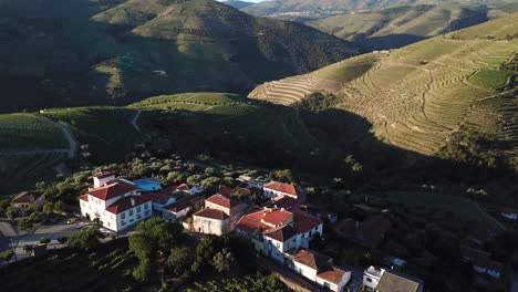 tilting down to view a manor house atop a hill in the picturesque douro valley in portugal