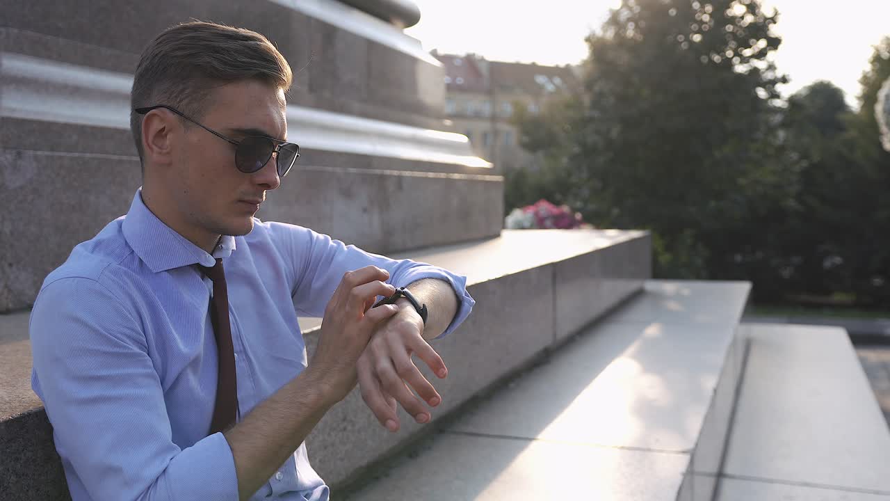 Man using smartwatch in the city