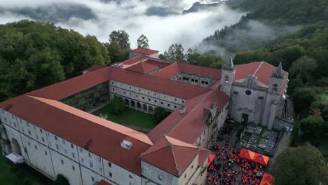 drone view of santo estevo monastery and foggy sil canyon, luintra, spain