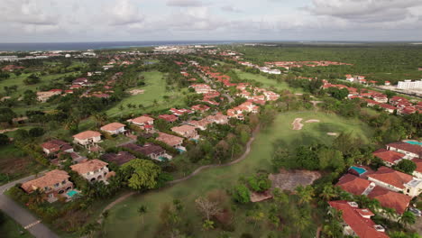 aerial flying over cocotal golf and country club and villas in punta cana