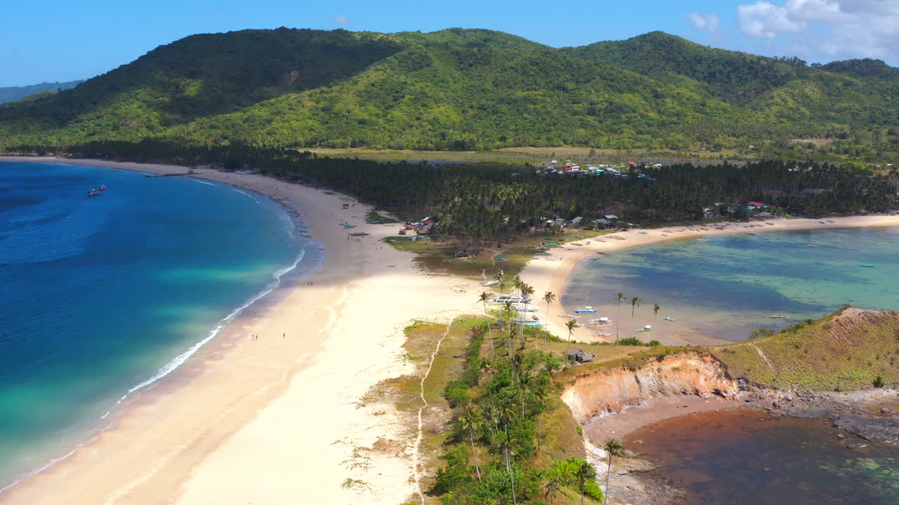 Aerial View of Tropical Twin Beach with Lush Mountains and Clear Blue Water