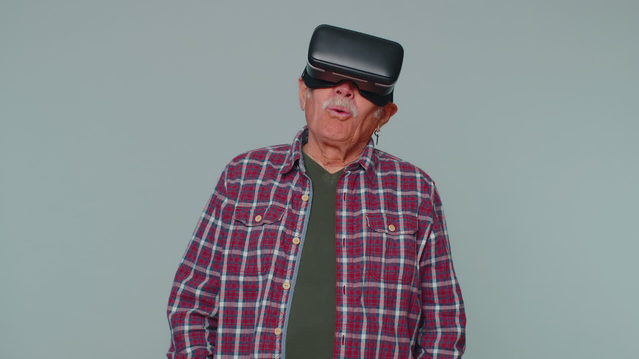 Man using virtual reality futuristic technology VR headset helmet to play simulation 3D video game