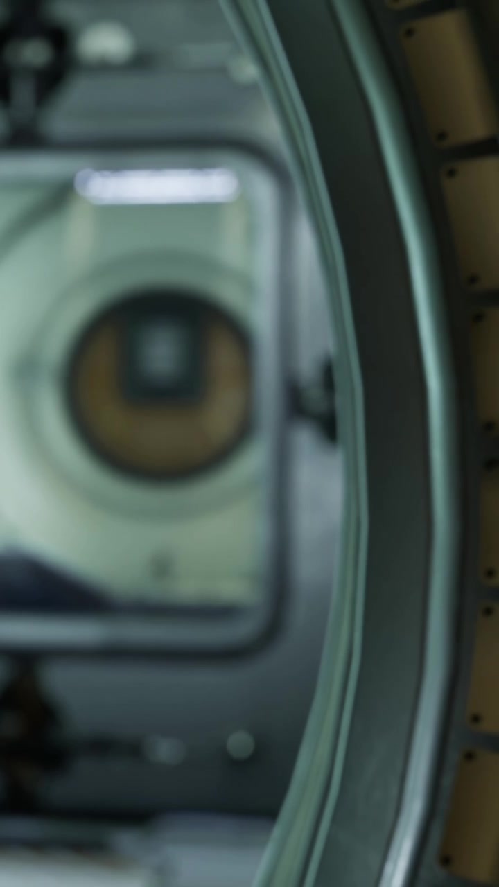 Detail of a camera lens and its surrounding equipment in a studio setting