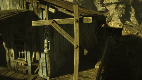 rustic wooden structure with lantern and weathered appearance near canyon
