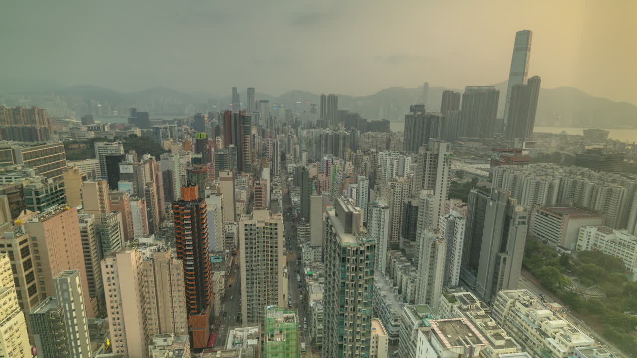HONG KONG - 19 MARCH 2025 : Timelapse of the Hong Kong kowloon skyline from a high vantage point