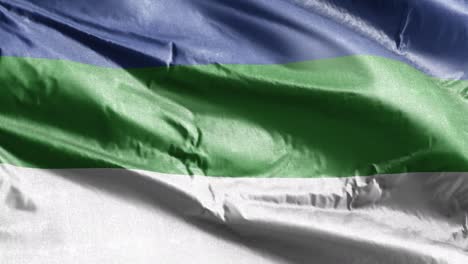 la bandera textil komi se agita lentamente en el bucle del viento. la bandera komsky se balancea suavemente en la brisa. el tejido textil de tela. el fondo de relleno completo. bucle de 20 segundos.