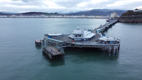 early morning llandudno pier historic victorian wooden boardwalk seaside landmark aerial view orbit right