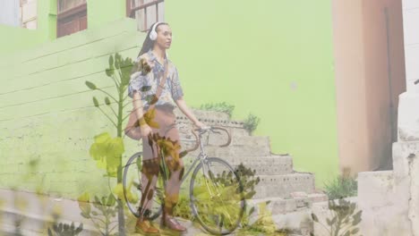 animación de plantas sobre hombre biracial caminando con bicicleta