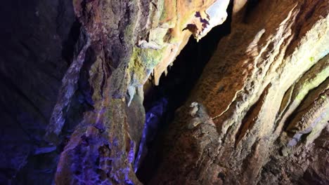 colorful walls in the caves of rochefort with natural light effect, saint-pierre-sur-erve, mayenne, france