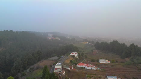 a small coastal village in the canary islands,spain,the whole are covered with heavy fog