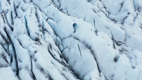 glacier surface with fissured ice cracks, iceland, aerial