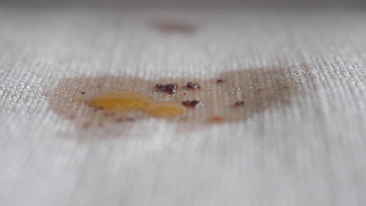 Close-up of a coffee stain on white fabric