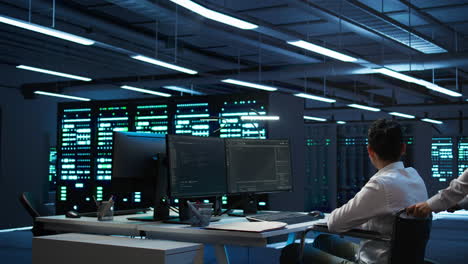 woman in wheelchair doing maintenance on server room infrastructure