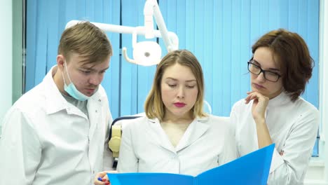 dental team discussing a patient case