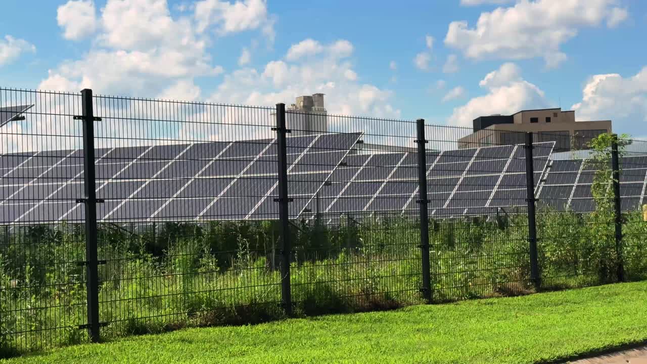 Solar Panels Behind a Fence